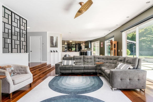 living room with recessed lighting and wood finished floors