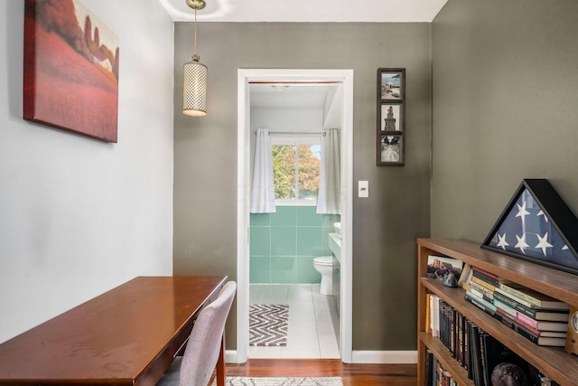 interior space with toilet and wood finished floors