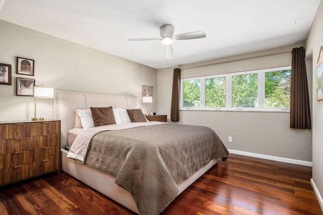 bedroom featuring wood finished floors, baseboards, and ceiling fan