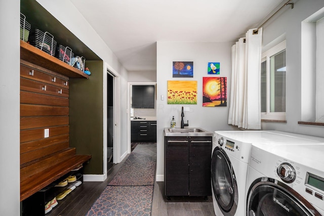 laundry room with independent washer and dryer, dark wood-type flooring, baseboards, and a sink