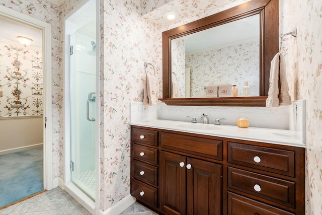 bathroom with tile patterned flooring, vanity, and a shower with door