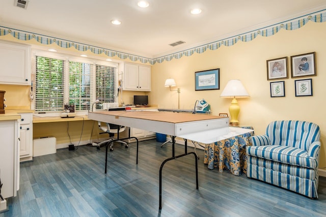 office area with dark hardwood / wood-style floors and built in desk