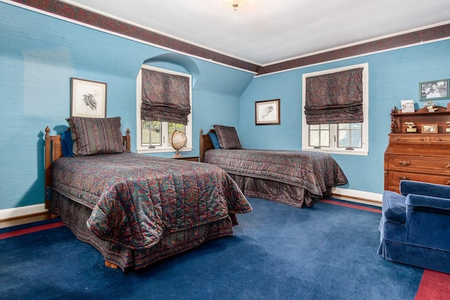 bedroom with carpet floors, vaulted ceiling, and crown molding