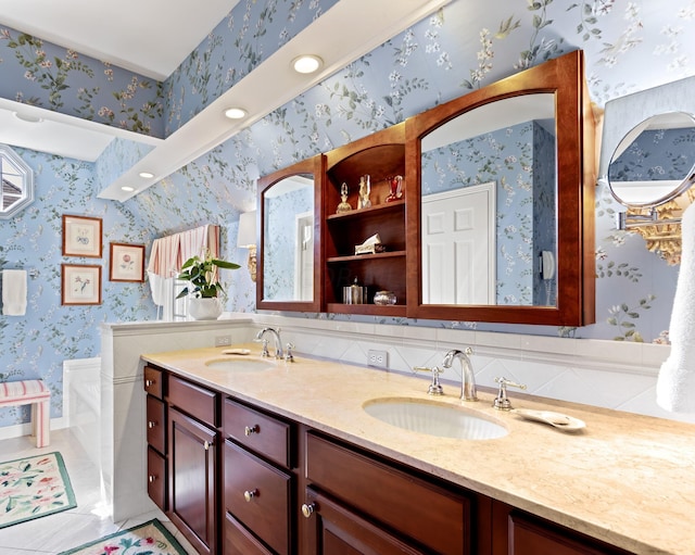 bathroom with tile patterned flooring and vanity