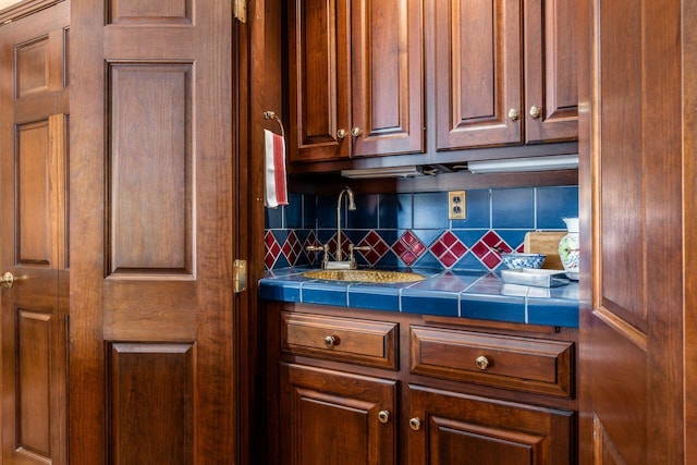 kitchen with decorative backsplash and sink