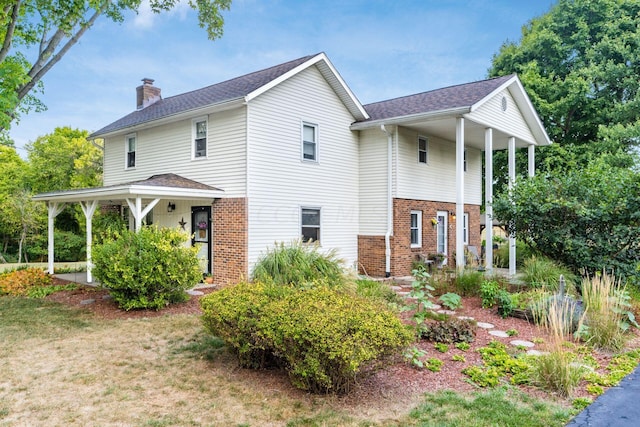 5595 Lancaster Rd, Hebron, OH 43025 - view of front of property with a front lawn and a porch