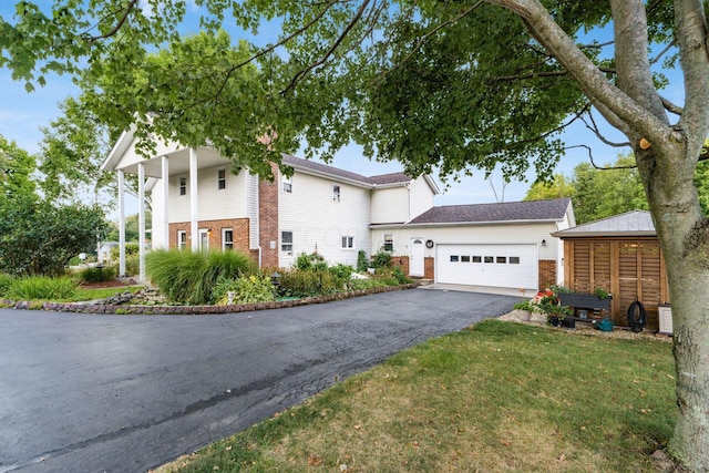 5595 Lancaster Rd, Hebron, OH 43025 - view of front of house with a garage and a front yard