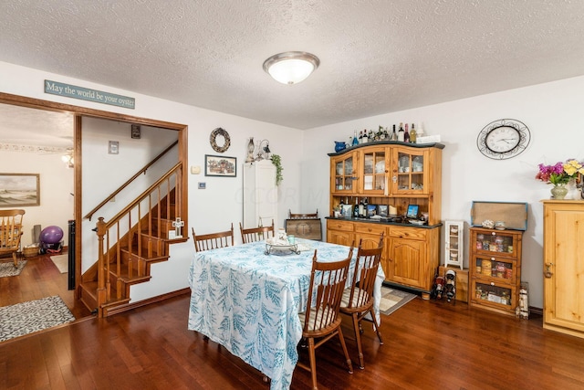 5595 Lancaster Rd, Hebron, OH 43025 - dining room featuring a textured ceiling and dark hardwood / wood-style floors