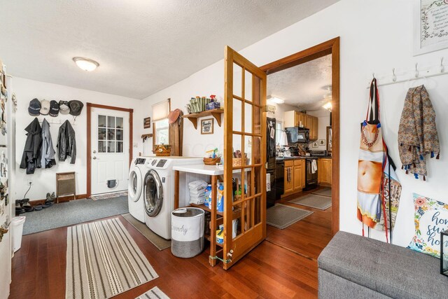 5595 Lancaster Rd, Hebron, OH 43025 - clothes washing area with a textured ceiling, dark hardwood / wood-style floors, and washing machine and clothes dryer