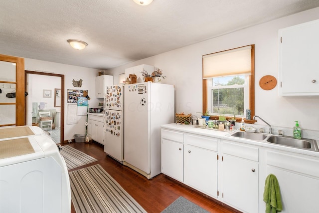 5595 Lancaster Rd, Hebron, OH 43025 - kitchen with white cabinets, white refrigerator, sink, a textured ceiling, and dark hardwood / wood-style flooring