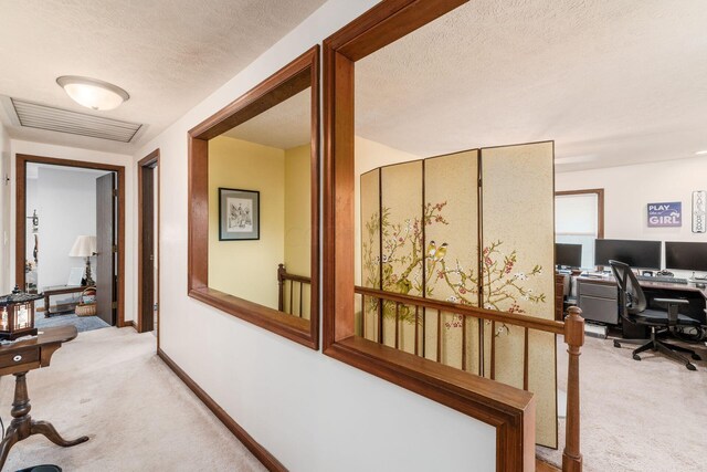 5595 Lancaster Rd, Hebron, OH 43025 - hallway featuring light colored carpet and a textured ceiling