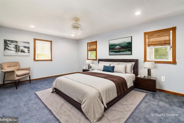 5595 Lancaster Rd, Hebron, OH 43025 - bedroom with ceiling fan and dark carpet