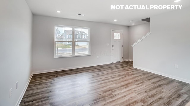 foyer entrance with hardwood / wood-style flooring