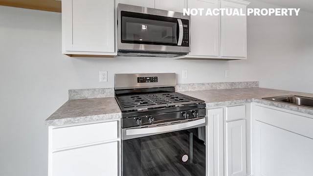 kitchen with white cabinets and stainless steel appliances