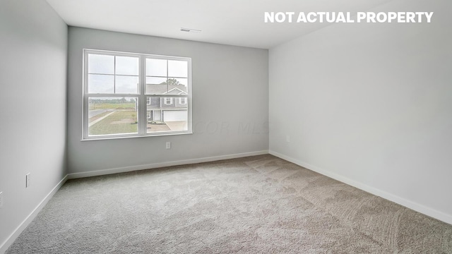 empty room featuring carpet flooring