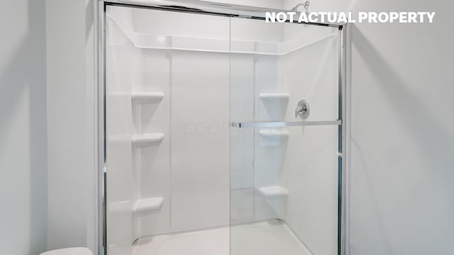 bathroom featuring walk in shower