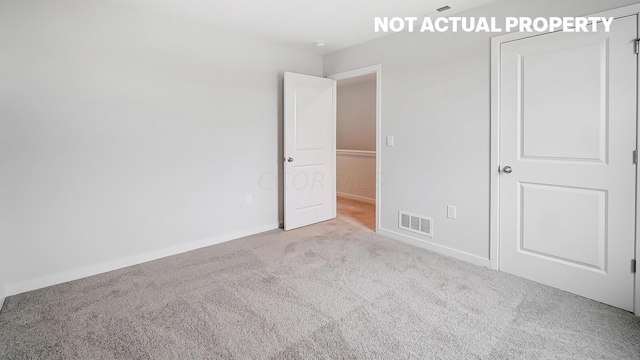 unfurnished bedroom with light carpet