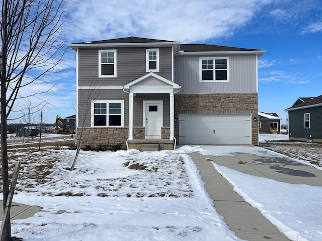 view of front of house featuring a garage, stone siding, and driveway