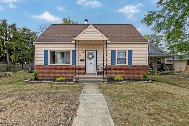 bungalow-style home featuring a front yard