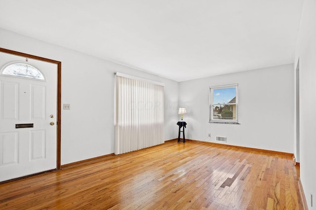 entryway with hardwood / wood-style floors