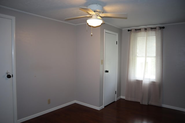 unfurnished room with dark hardwood / wood-style flooring, ceiling fan, and crown molding