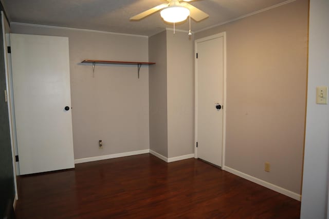 unfurnished bedroom with a closet, dark hardwood / wood-style floors, ceiling fan, and ornamental molding