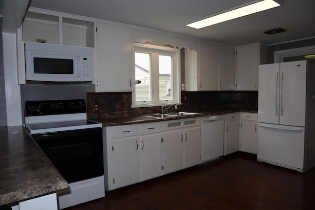 kitchen with decorative backsplash, white appliances, sink, dark hardwood / wood-style floors, and white cabinetry