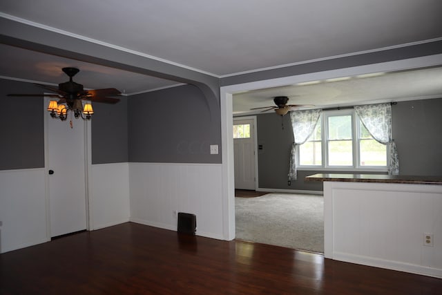 spare room with ceiling fan, ornamental molding, and hardwood / wood-style flooring