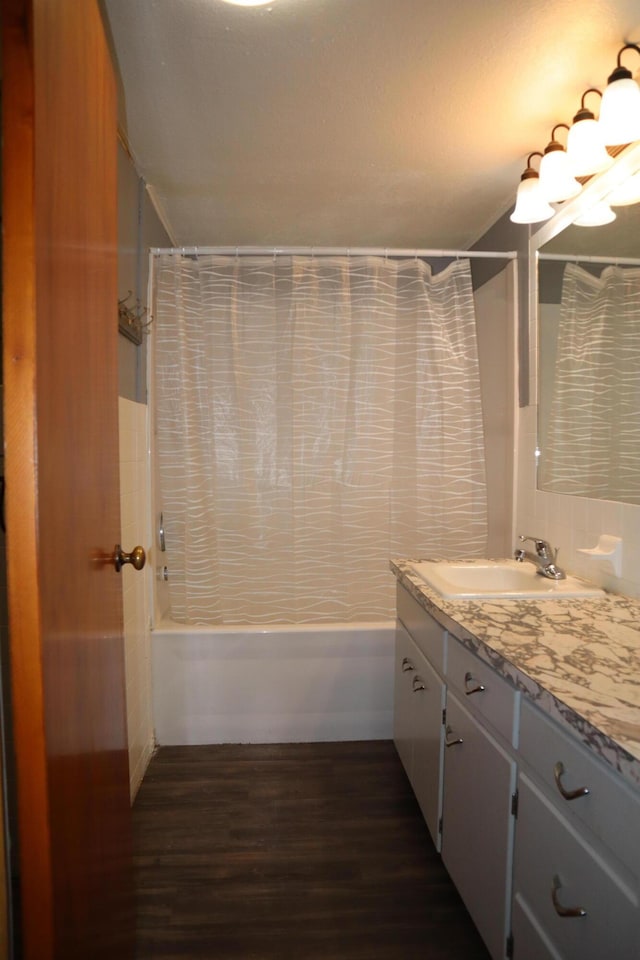 bathroom featuring shower / bath combo with shower curtain, vanity, and wood-type flooring