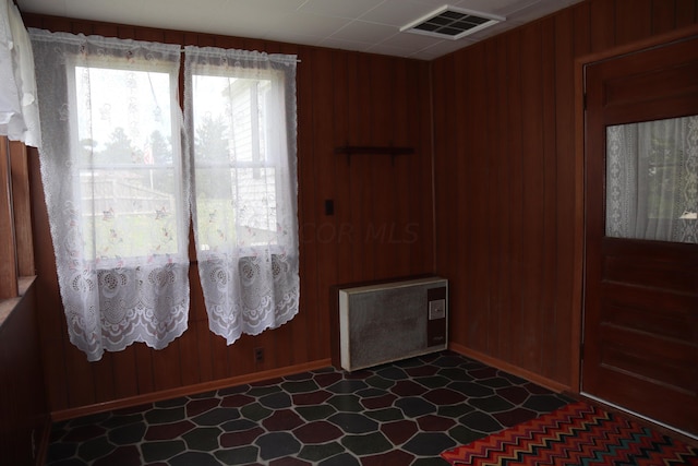 interior space featuring wooden walls