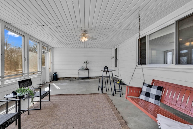 sunroom / solarium with ceiling fan