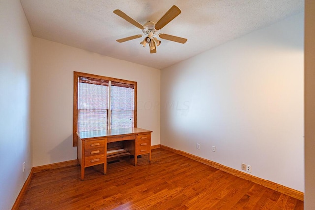 office with hardwood / wood-style flooring, ceiling fan, and a textured ceiling