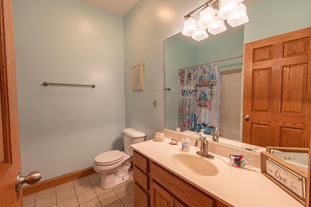 bathroom featuring toilet, vanity, a shower with shower curtain, and tile patterned floors