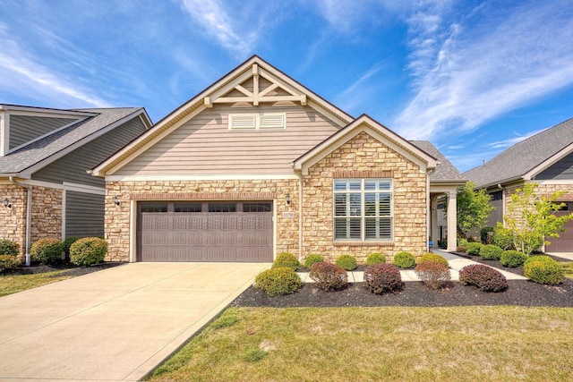 craftsman-style home featuring a front lawn and a garage