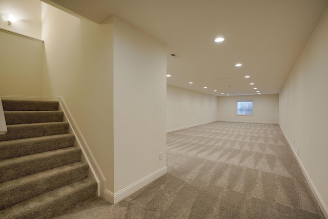 basement with light colored carpet