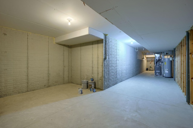 basement featuring heating unit and water heater