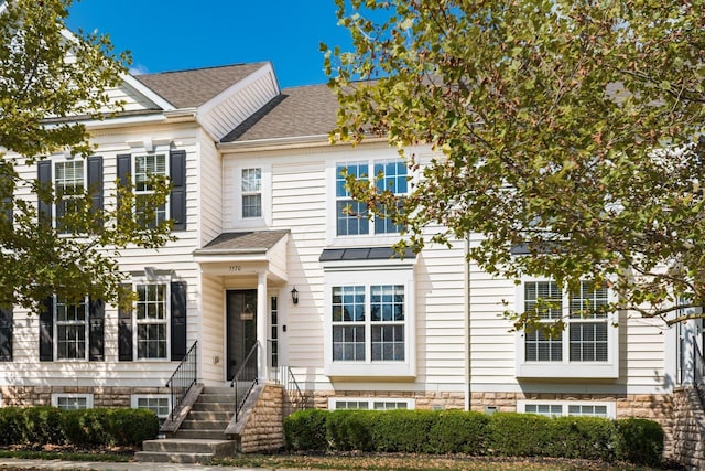 view of front of property with a shingled roof