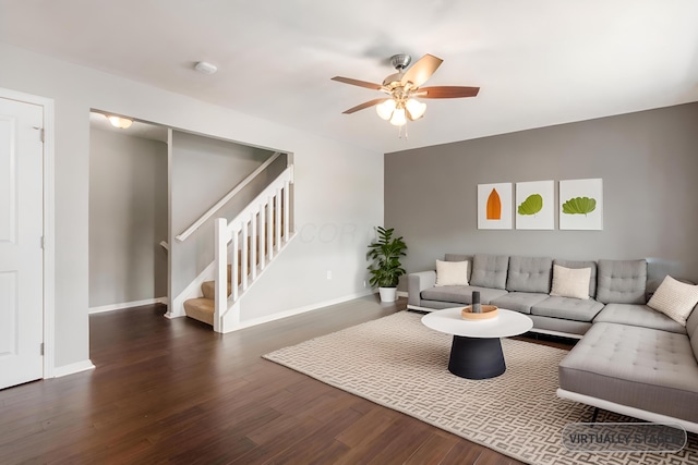 living area with ceiling fan, stairway, wood finished floors, and baseboards