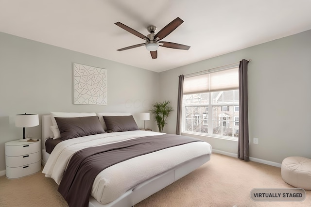 bedroom featuring carpet floors, ceiling fan, and baseboards