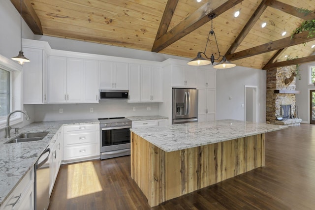 kitchen with white cabinets, a spacious island, sink, and appliances with stainless steel finishes