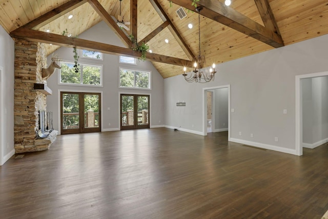 unfurnished living room featuring french doors, wood ceiling, dark wood-type flooring, high vaulted ceiling, and beamed ceiling