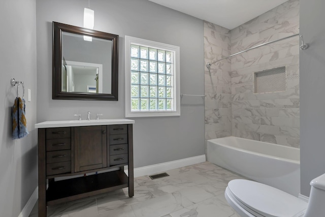 full bathroom featuring vanity, toilet, and tiled shower / bath combo