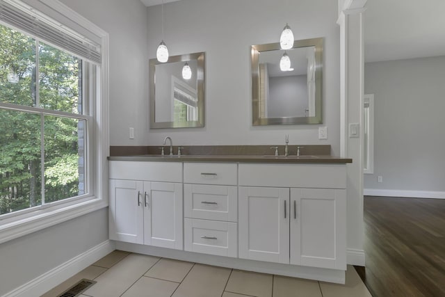 bathroom featuring hardwood / wood-style floors, vanity, and a wealth of natural light