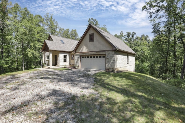 view of front of house with a front lawn and a garage