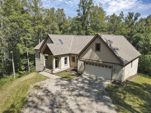 view of front of house with a porch, a garage, and a front yard