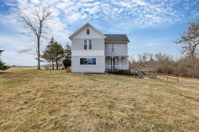 view of front facade with a porch and a front lawn