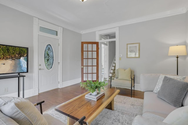 living room with light hardwood / wood-style floors and crown molding