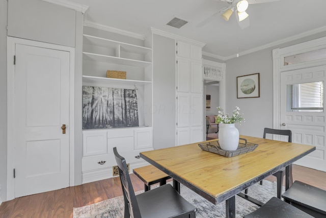 dining room with hardwood / wood-style flooring, ceiling fan, and ornamental molding