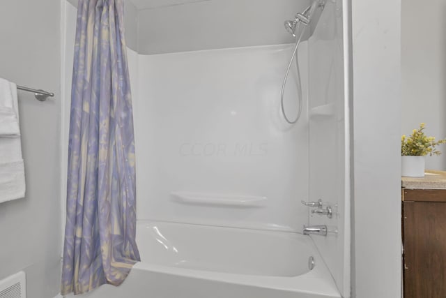 bathroom with shower / bathtub combination with curtain