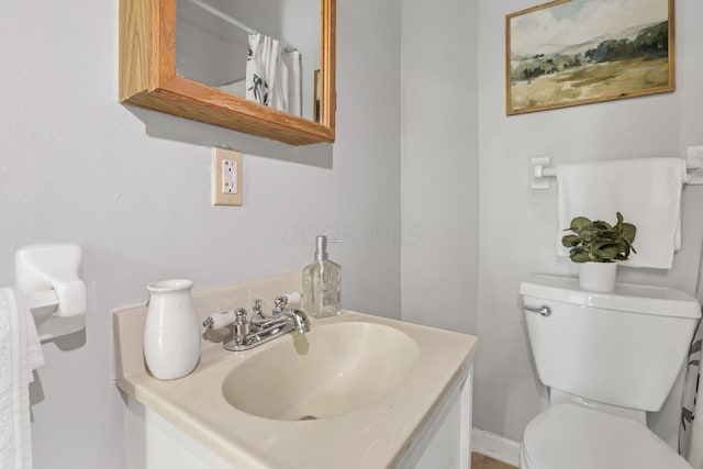 bathroom with vanity and toilet